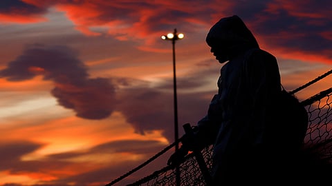 FILE PHOTO: A person disembarks the Geo Barents rescue ship, operated by Medecins Sans Frontieres (Doctors Without Borders), in Bari, Italy March 26, 2023. 