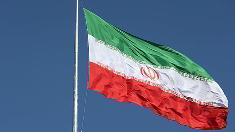 FILE PHOTO: The Iranian flag is seen flying over a street in Tehran, Iran, February 3, 2023. 