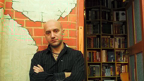 FILE PHOTO: Russian writer Zakhar Prilepin poses for a picture in his flat in Nizhny Novgorod, Russia, December 6, 2008. 