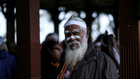 FILE PHOTO: Aboriginal group member looks on during a protest against what the groups say is a lack of detail and consultation on new heritage protection laws, after the Rio Tinto mining group destroyed ancient rock shelters for an iron ore mine last year, in Perth, Australia August 19, 2021. 
