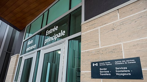 FILE PHOTO: The main entrance to the Canadian Border Services Agency border crossing at the Thousand Islands Bridge after it was announced that the border would close to "non-essential traffic" to combat the spread of novel coronavirus disease (COVID-19) at the U.S.-Canada border crossing at the Thousand Islands Bridge in Lansdowne, Ontario, Canada March 19, 2020. 