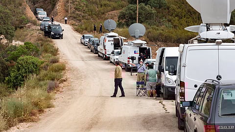Journalists work as the police search the Arade reservoir near the area where British girl Madeleine McCann went missing in the Portuguese Algarve in May 2007, in Silves, Portugal, May 24, 2023. 