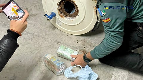 Packs of euro banknotes are seen during a raid where more than 3.5 million packets of contraband tobacco were seized, in Seville, Spain, in this picture released on January 22, 2023. 