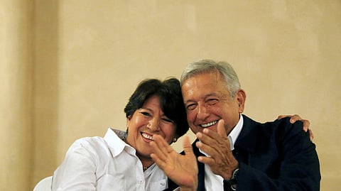 FILE PHOTO: Delfina Gomez of the National Regeneration Movement (MORENA), candidate for the governor of the State of Mexico, smiles next to Andres Manuel Lopez Obrador, leader of MORENA during a news conference in Mexico City, Mexico June 6, 2017. 