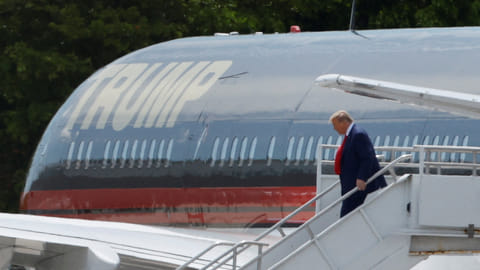 Former U.S. President Donald Trump arrives at Miami International Airport as he is to appear in a federal court on classified document charges, in Miami, Florida, June 12, 2023. 