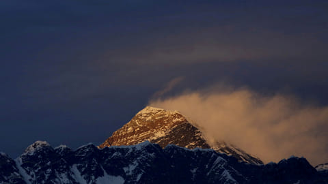 FILE PHOTO: Light illuminates Mount Everest, during sunset in Solukhumbu District also known as the Everest region, November 30, 2015. 