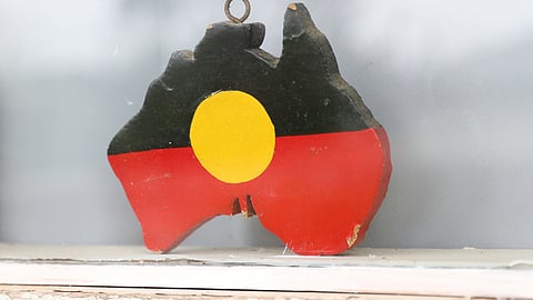 FILE PHOTO: A depiction of the Australian Aboriginal Flag is seen on a window sill at the home of indigenous Muruwari elder Rita Wright, a member of the "Stolen Generations", in Sydney, Australia, January 19, 2021. 