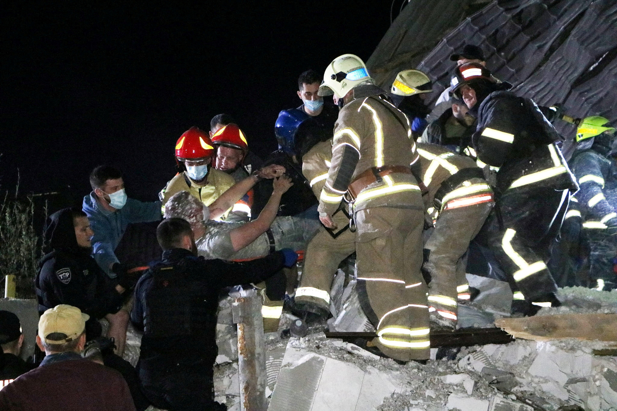 Emergency workers rescue a man from debris of a residential building heavily damaged by a Russian missile strike, amid Russia's attack on Ukraine, on outskirt of the Dnipro city, Ukraine June 3, 2023. 