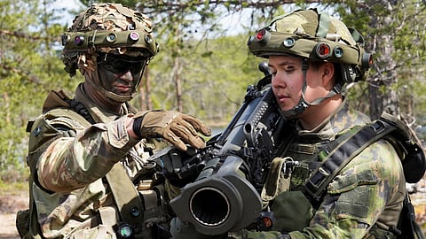 A U.S. soldier instructs a Finnish soldier on the Carl Gustaf recoilless rifle during the Northern Forest land force exercise in Rovajarvi, Finland May 30, 2023. 