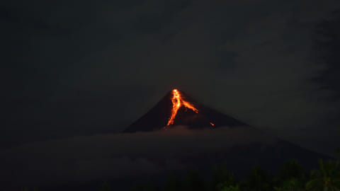 Lava flows from Mount Mayon volcano, in Daraga, Philippines June 11, 2023, in this picture obtained from social media. 
