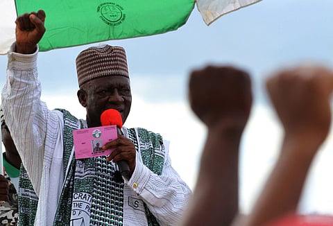 FILE PHOTO: Presidential candidate John Fru Ndi from the opposition Social Democratic Front (SDF) speaks at his final campaign rally outside the national stadium a day before Cameroon's presidential election in Yaounde October 8, 2011. 