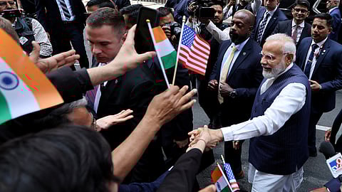 Indian Prime Minister Narendra Modi greets supporters as he arrives at the Lotte hotel in New York City, New York, U.S., June 20, 2023. 