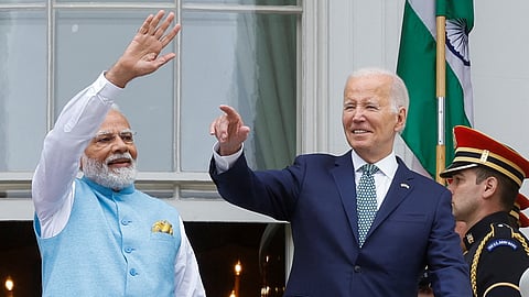 India’s Prime Minister Narendra Modi and U.S. President Joe Biden wave and gesture to the crowd as they stand on the Truman Balcony of the White House after an official State Arrival Ceremony held at the start of Modi's visit to the White House in Washington, U.S., June 22, 2023. 