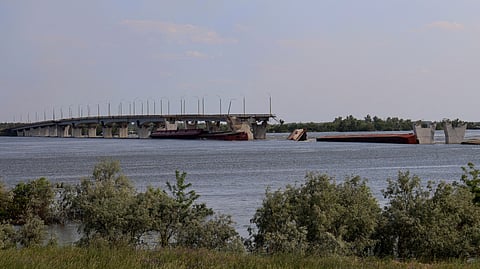 FILE PHOTO: Destroyed Antonivskyi bridge is seen over the flooded Dnipro river after the Nova Kakhovka dam breached, amid Russia's attack on Ukraine, near Kherson, Ukraine June 8, 2023. 
