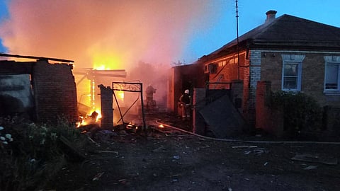 Firefighters work at a house on fire following a shelling, which, according to the regional governor, was by Ukrainian forces, in the village of Sobolevka, Belgorod region, Russia, in this handout image released June 2, 2023. 