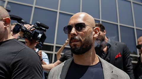 FILE PHOTO: Andrew Tate, escorted by bodyguards, leaves the Bucharest Tribunal in Bucharest, Romania, June 21, 2023. 