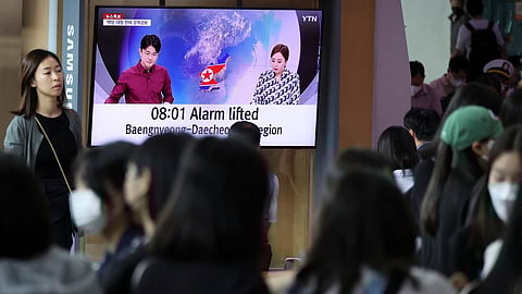 People watch a TV broadcasting a news report on North Korea firing what it called a space satellite toward the south, in Seoul, South Korea, May 31, 2023. 
