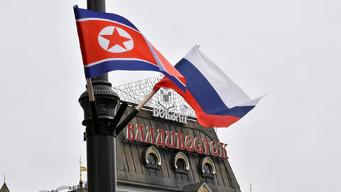 FILE PHOTO: State flags of Russia and North Korea fly in a street near a railway station during the visit of North Korea's leader Kim Jong Un to Vladivostok, Russia April 25, 2019. 