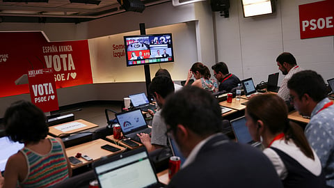 Journalists work as they await the election results, outside the party PSOE headquarters, on the day of the general election, in Madrid, Spain, July 23, 2023. 