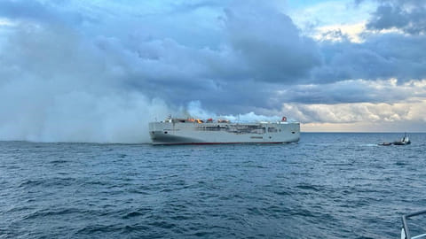 Smoke rises as a fire broke out on the cargo ship Fremantle Highway, at sea on July 26, 2023. Coastguard 