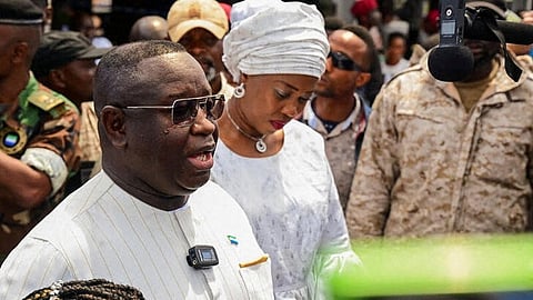 Sierra Leone's President and ruling party candidate Julius Maada Bio speaks to journalists after casting his vote at a polling station in Freetown, Sierra Leone, June 24, 2023. 