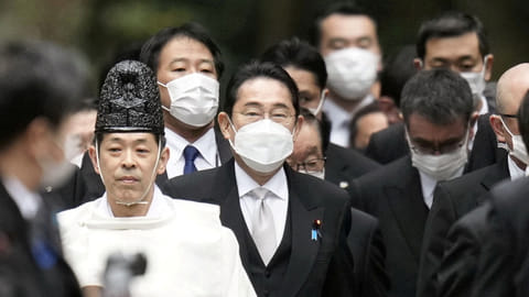 FILE PHOTO: Japan's Prime Minister Fumio Kishida and his cabinet ministers are led by a shinto priests during a customary New Year's visit at Ise shrine in Ise, central Japan, in this photo taken by Kyodo January 4, 2023. 
