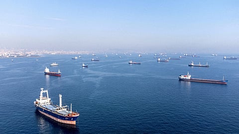 FILE PHOTO: Commercial vessels including vessels which are part of Black Sea grain deal wait to pass the Bosphorus strait off the shores of Yenikapi during a misty morning in Istanbul, Turkey, October 31, 2022. 
