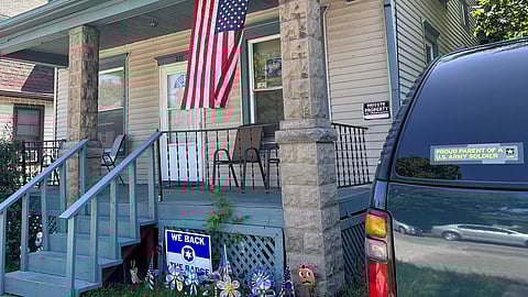 FILE PHOTO: A U.S. flag hangs on the porch and a "Proud parent of a U.S. Army soldier" sticker adorns the car outside the home of 23-year-old Private Travis King's mother in Racine, Wisconsin, U.S., July 19, 2023. 