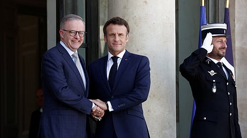 French President Emmanuel Macron shakes hands with Australian Prime Minister Anthony Albanese at the Elysee Palace in Paris, France, July 1, 2022. 