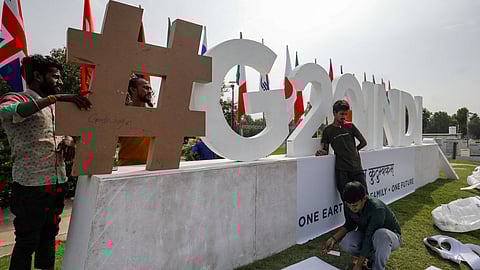 FILE PHOTO: Workers work near the venue of G20 Finance Ministers and Central Bank Governors meeting at Gandhinagar in Gujarat, India July 13, 2023. 