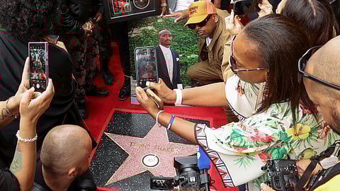 People take pictures of Rapper Tupac Shakur star during its posthumous unveiling ceremony on the Hollywood Walk of Fame in Los Angeles, California, U.S. June 7, 2023. 