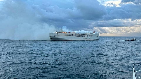 FILE PHOTO: Smoke rises as a fire broke out on the cargo ship Fremantle Highway, at sea on July 26, 2023. 