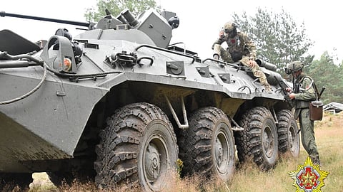 A fighter from Russian Wagner mercenary group and a Belarusian service member take part in a joint training at the Brest military range outside Brest, Belarus, in this still image released July 20, 2023. 