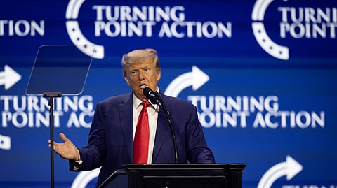 FILE PHOTO: Former U.S. President and Republican presidential candidate Donald Trump gestures as he speaks during the Turning Point Action Conference in West Palm Beach, Florida, U.S. July 15, 2023. 