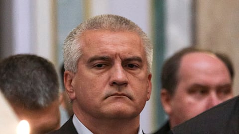 FILE PHOTO: People, the Russian governor of Crimea Sergei Aksyonov, attend a memorial service for Kirill Stremousov, deputy head of the Russian-installed Kherson regional administration in Ukraine who reportedly died in a car crash, in Simferopol, Crimea, November 11, 2022. 