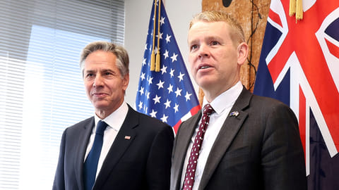 U.S. Secretary of State Antony Blinken (L) poses with New Zealand's Prime Minister Chris Hipkins at Parliament in Wellington on July 27, 2023. 