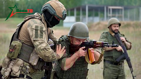 FILE PHOTO: A fighter from Russian Wagner mercenary group conducts training for Belarusian soldiers on a range near the town of Osipovichi, Belarus July 14, 2023 in this still image taken from handout video. 