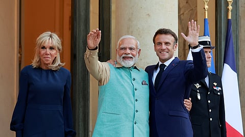 French President Emmanuel Macron and his wife Brigitte Macron welcome Indian Prime Minister Narendra Modi at the Elysee Palace, in Paris, France, July 13, 2023. 