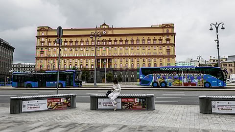 FILE PHOTO: A woman uses her mobile phone in front of the Federal Security Service (FSB) building on Lubyanka Square in Moscow, Russia, June 24, 2023. 
