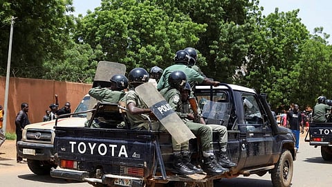 FILE PHOTO: Nigerien security forces prepare to disperse pro-junta demonstrators gathered outside the French embassy, in Niamey, the capital city of Niger July 30, 2023. 