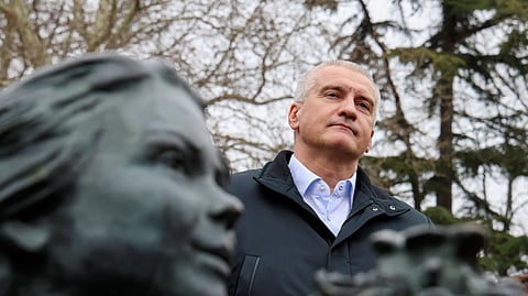 Russian governor of Crimea Sergei Aksyonov takes part in a ceremony marking the ninth anniversary of the Crimean referendum at the monument to the so-called "Polite People" or the Russian service members, who enhanced security during Russia's annexation of Crimea, in Simferopol, Crimea, March 16, 2023. 
