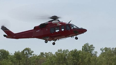 A helicopter takes off following U.S. military aircraft crash in Darwin, Australia, August 27, 2023 in this screen grab obtained from a handout video. 