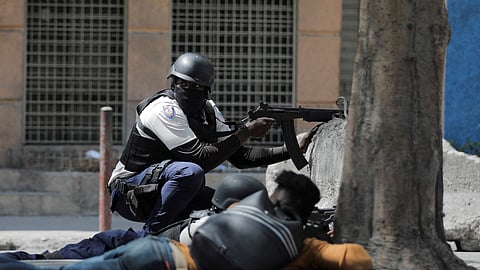 FILE PHOTO: A police officer takes position during an anti-gang operation amid gang violence in Port-au-Prince, Haiti March 3, 2023. 