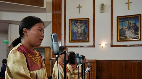 FILE PHOTO: Choir members sing during a Sunday mass at Saints Peter and Paul Cathedral, a Roman Catholic church, in Ulaanbaatar, Mongolia August 27, 2023. 