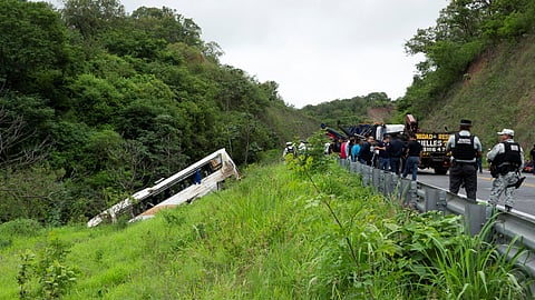 Authorities work to remove a passenger bus that plunged off a highway killing several people, in Tepic, Mexico August 3,2023. 