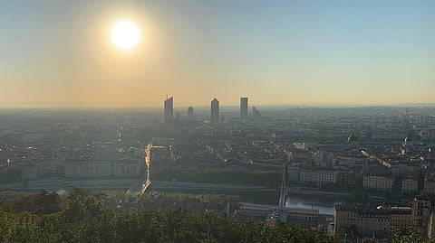 FILE PHOTO: A general view shows the city of Lyon after sunrise from the Fourviere esplanade as France issued a "red alert" for four southern regions amid a spell of excessively hot weather, especially in the Rhone valley, France, August 22, 2023. 