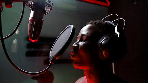 Oze Makvala, 19, a homeless teenager who has slept rough on the streets for years, sings at the studio of Mokili Na Poche cultural centre, a Congolese arts refuge that helps street children, in Kinshasa, Democratic Republic of Congo September 5, 2023. 