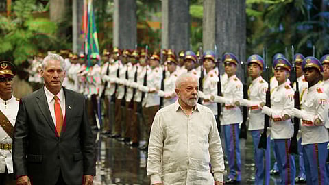 Cuba's President Miguel Diaz-Canel and Brazil's President Luiz Inacio Lula da Silva review an honour guard at the Revolution Palace during the G77+China summit in Havana, Cuba, September 16, 2023. 