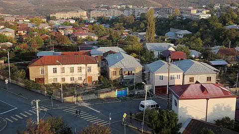 FILE PHOTO: People cross a street in Stepanakert, the capital of the breakaway region of Nagorno-Karabakh, October 19, 2020. 