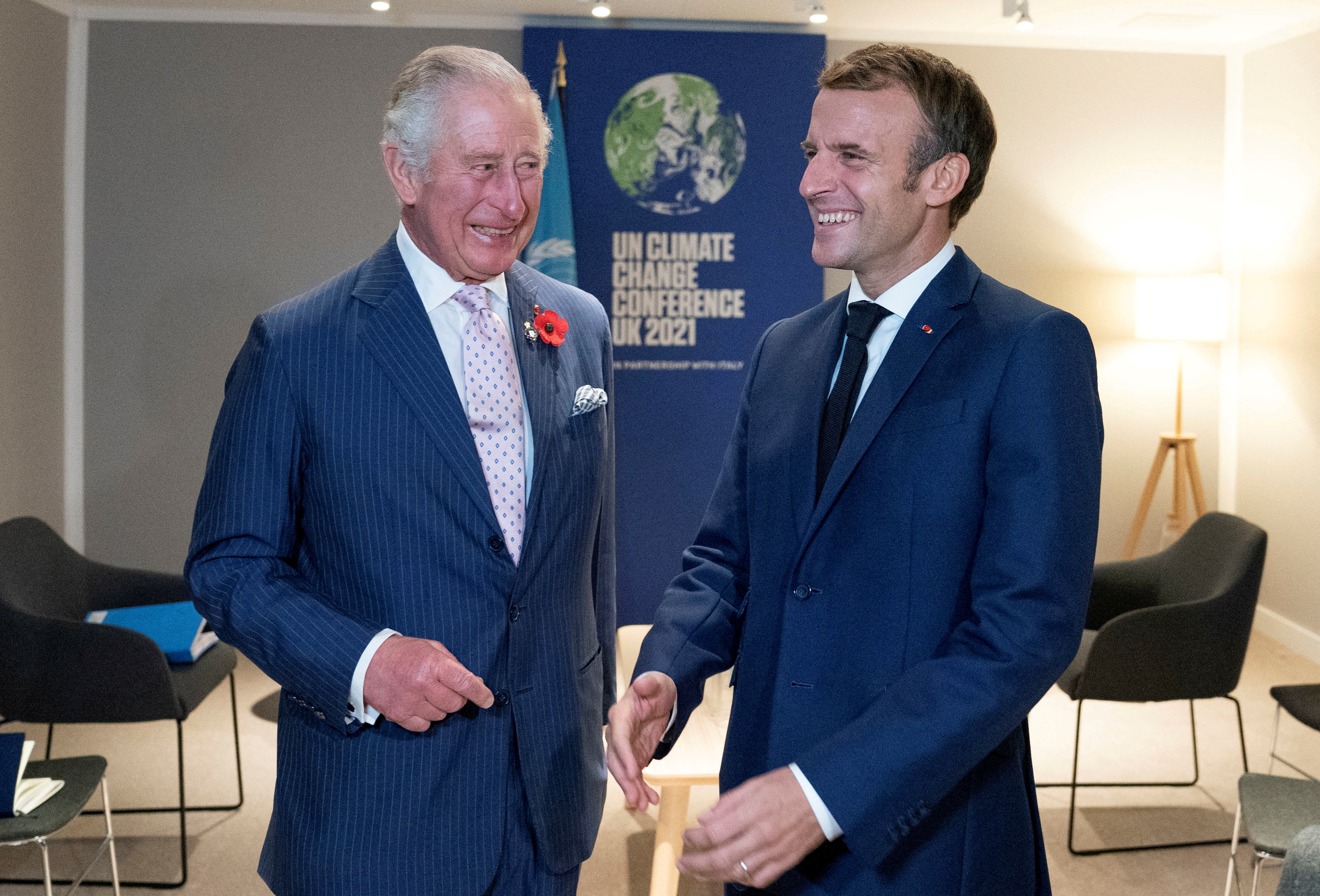FILE PHOTO: Britain's Charles, Prince of Wales, greets France's President Emmanuel Macron ahead of their bilateral meeting on the sidelines of the UN Climate Change Conference (COP26) in Glasgow, Scotland, Britain November 1, 2021.